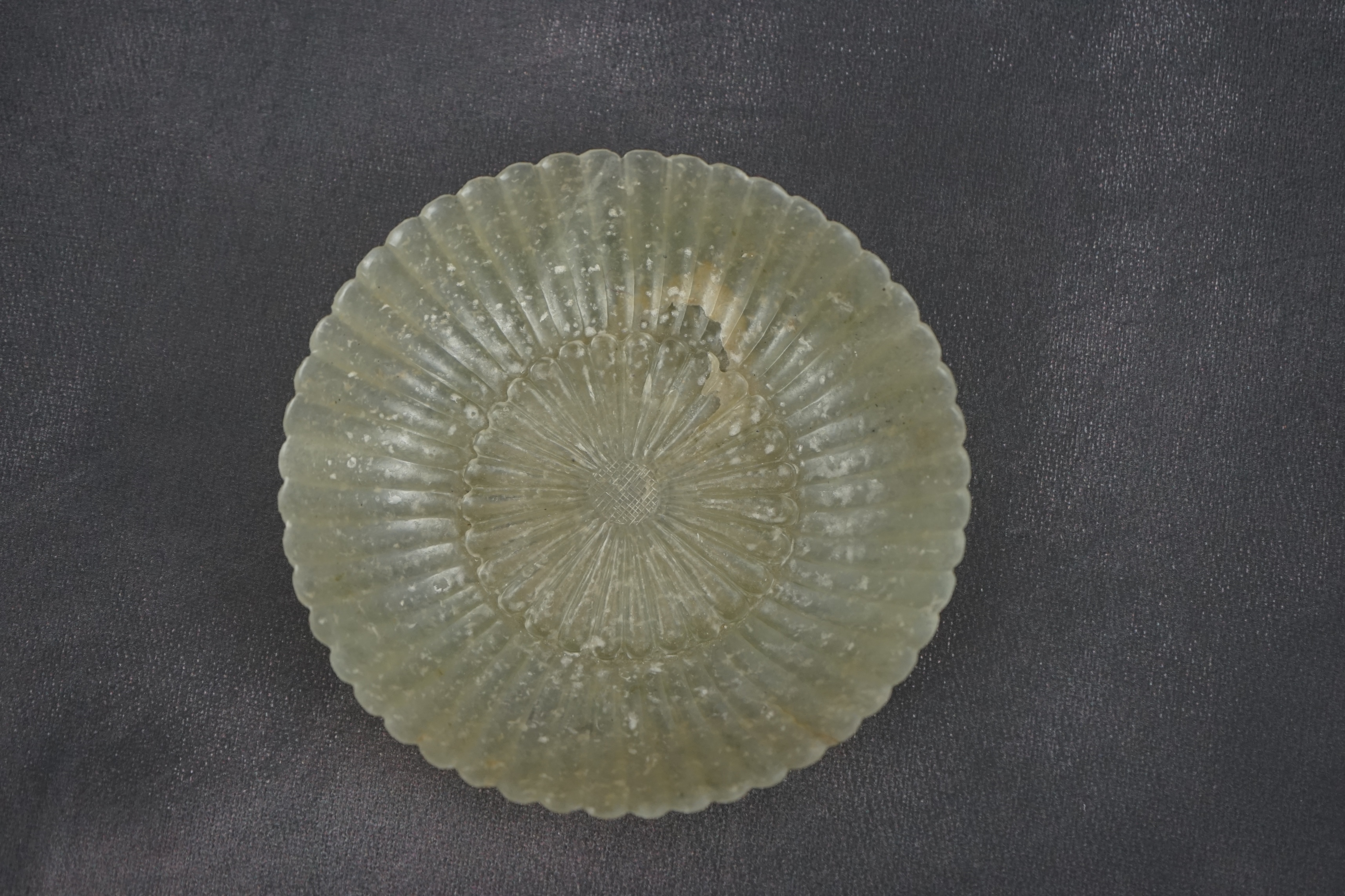 A Chinese pale celadon jade ‘chrysanthemum’ dish, Mughal style, 18th century